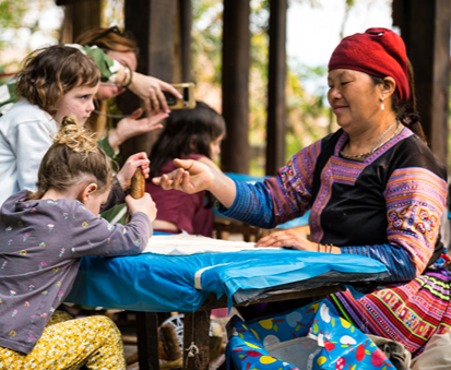 The women embrace a H’mong time-honored craft